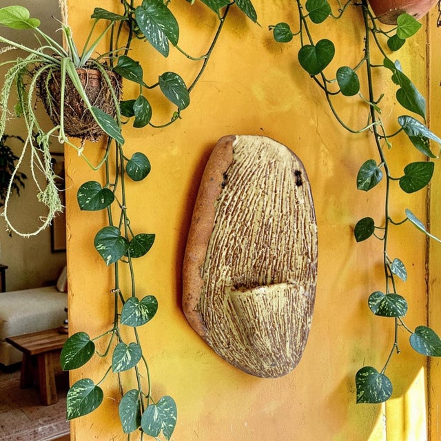 Elevate your home decor with our Vintage Organic Ceramic Wall Pocket, expertly artisan-made to bring a touch of charm and...