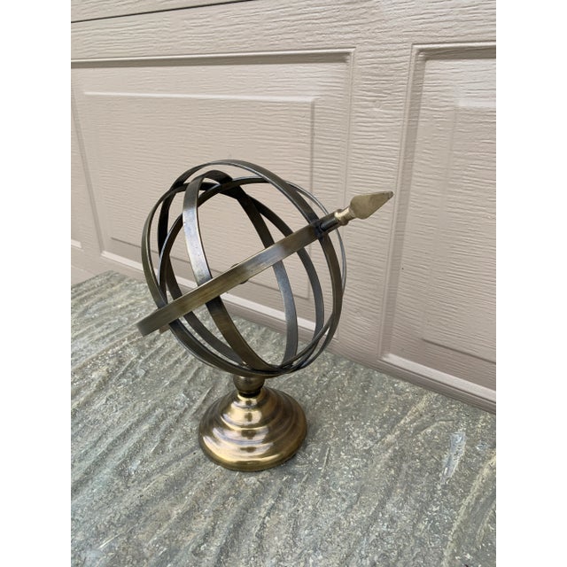 A beautifully crafted brass armillary sphere, evoking the timeless elegance of classical European gardens. Pieces like...