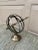 A beautifully crafted brass armillary sphere, evoking the timeless elegance of classical European gardens. Pieces like...