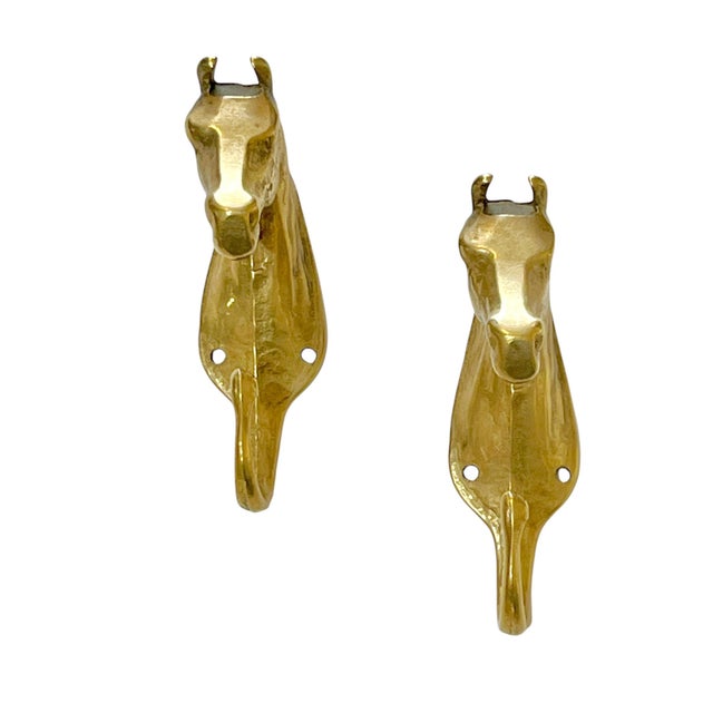 Pair of vintage brass horse coat hooks. Great to have a pair! Sourced in France.