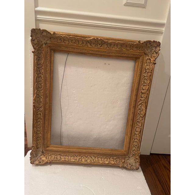 Impressive ornate vintage gold whitewashed giltwood frame with elaborate carved details. Perfect for a beautiful piece of...