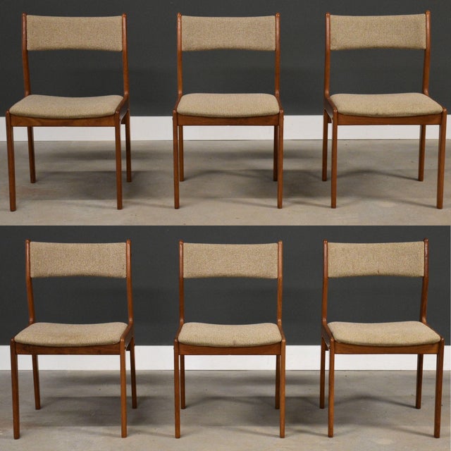 A set of six mid century modern solid teak dining chairs with original beige back rests and seats by Scanthai. Minor...
