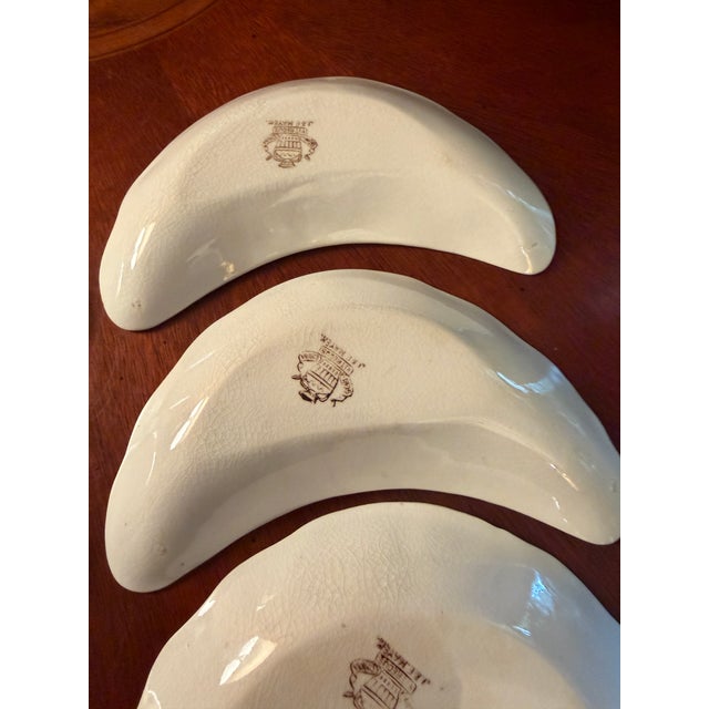 For sale is a complete matching antique set of six (6) rare Victorian crescent-shaped bone dishes manufactured by J. & E....