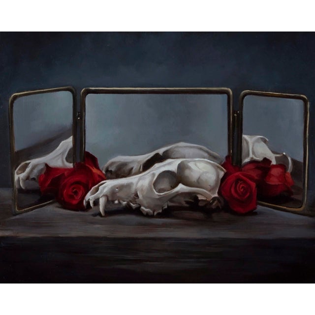 This oil on panel artwork presents a striking still life featuring animal skulls delicately arranged with vibrant red...