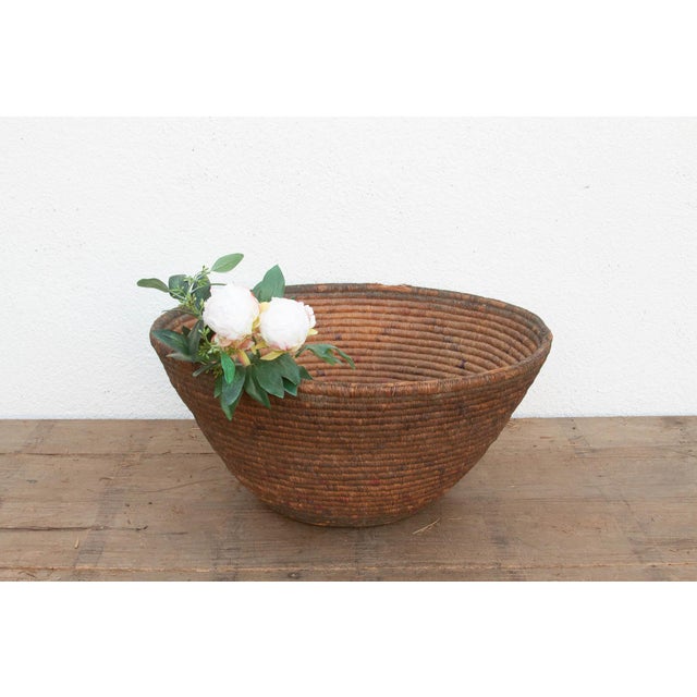 This 24-inch nomadic winnowing bowl is a beautiful study in cultural adaptation and functional longevity. Originally hand-...