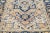The antique Heriz rug's premium hand-knotted wool and striking medallion design exude timeless elegance and...