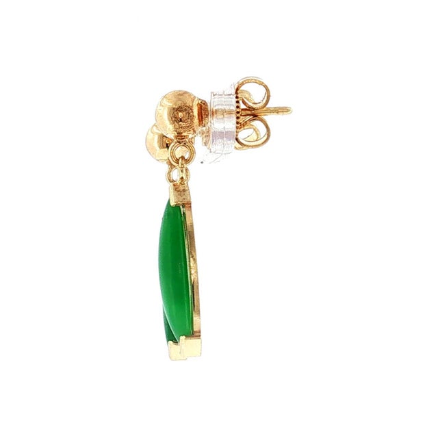 A pair of late 20th-century 14 K gold drop earrings featuring marquise-cut green jadeite stones. These elegant earrings...