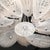 This Modernist hand-blown Murano glass chandelier, crafted in Italy during the 20th century, is a stunning testament to...