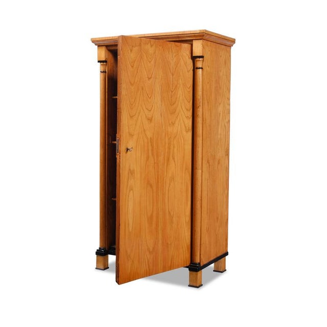 Half-cabinet from southern Germany, Biedermeier period, circa 1830; ash wood; single door; two half-columns; height-...