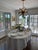Transitional Anterior Waldorf 8 Light Crystal and Antique Brass Chandelier For Sale - Image 3 of 4