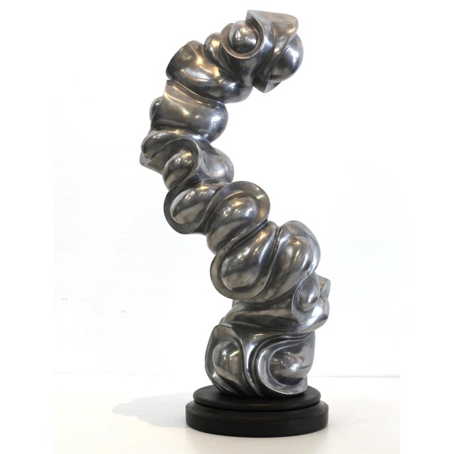 Jacob Burmood creates undulating abstract cold cast aluminum sculptures, intuitively redefining aesthetic shapes and...