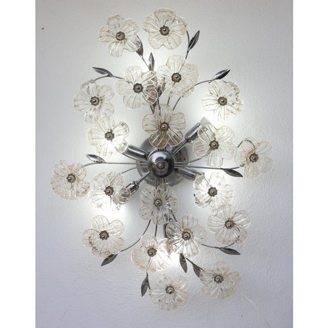 A charming six-light ceiling fixture with gold-colored Murano glass flowers. In good vintage condition. Chrome-plated...