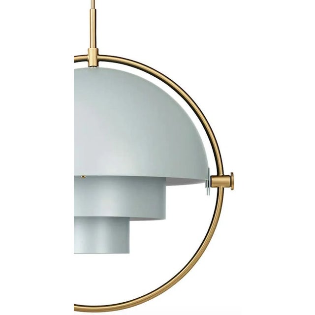 Louis Weisdorf 'Multi-Lite' pendant lamp in sea gray and brass. Designed in 1972 by Weisdorf, this is an authorized re-...