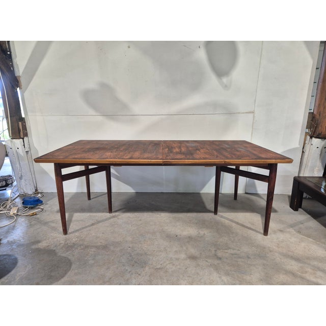 This beautiful rosewood table by Arne vodder is called the model 201. This table usually has an extra piece for extension...
