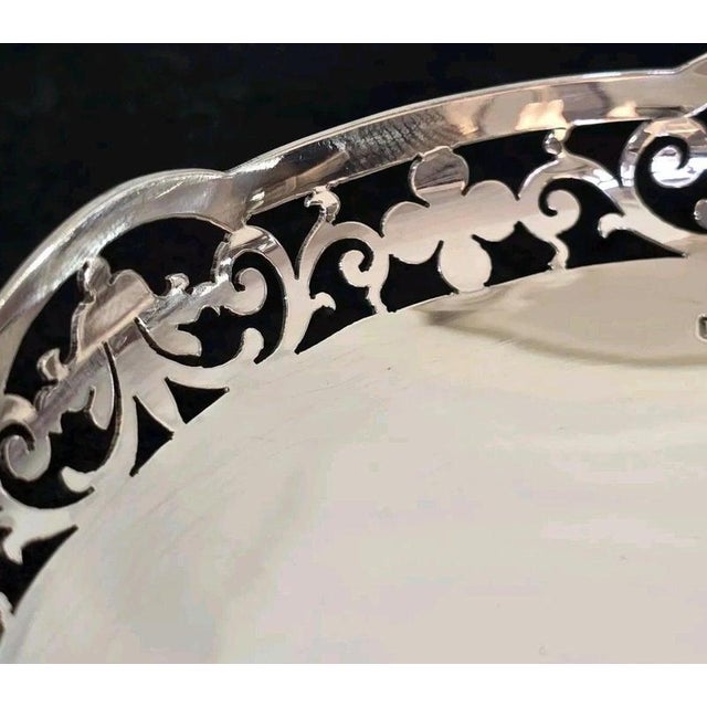 A fine pair of George VI sterling silver trinket or bon bon dishes, dating to 1943 and displaying elegant traditional...
