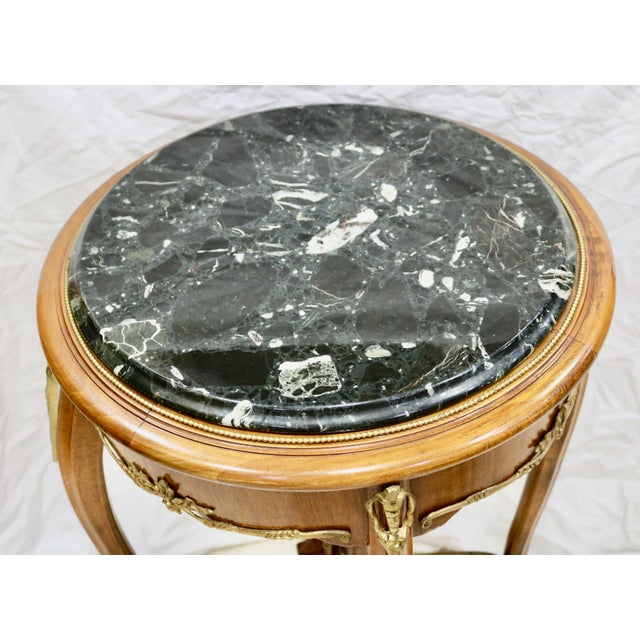 Antique Italian Rococo Round Black Marble Top Table with Ormolu Trims on the Apron and Legs