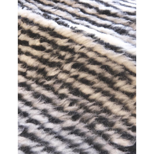 Enhance your home decor with our Contemporary Moroccan Wool Rug. Made from soft wool, it measures 7.4 x 3.9 ft and adds a...