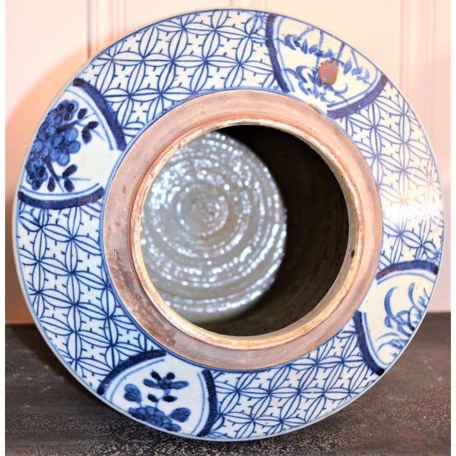 This is a beautiful Blue and White Porcelain very large Cylinder Tea Jar. It is decorated with beautiful mums and field...