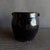 Small black glazed pottery, wabi sabi style with perfect imperfections. Overall Size: 7.5"D x 7.5"H Opening: 5"