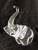 A crystal elephant with raised trunk. Designed in 1964 by James Houston for Steuben Glass.