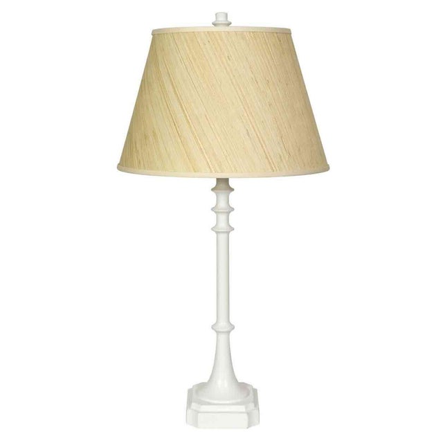 An elegant pair of tall table lamps featuring a sculptural column form finished in crisp white gesso. The slender,...