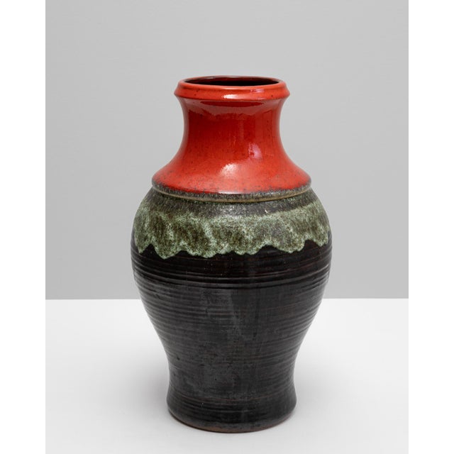 This 20th-century German ceramic vase embodies the bold and expressive aesthetic of mid-century European pottery....