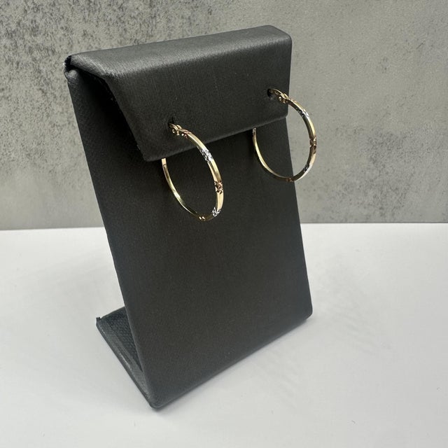 These elegant 14kt yellow gold hoop earrings feature beautiful rose and white gold accents, creating a soft tri-tone...