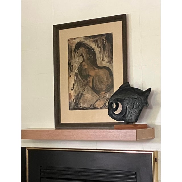 A striking and highly expressive mid-century study of a horse, executed in bold ink and atmospheric washes on paper. The...