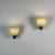 An exceptionally refined pair of wall sconces designed by Tomaso Buzzi for Venini during the 1940s, embodying the...
