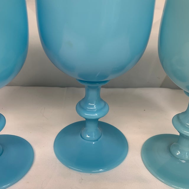 Elevate your tablescape or bar collection with this rare and highly collectible set of five vintage French opaline glass...