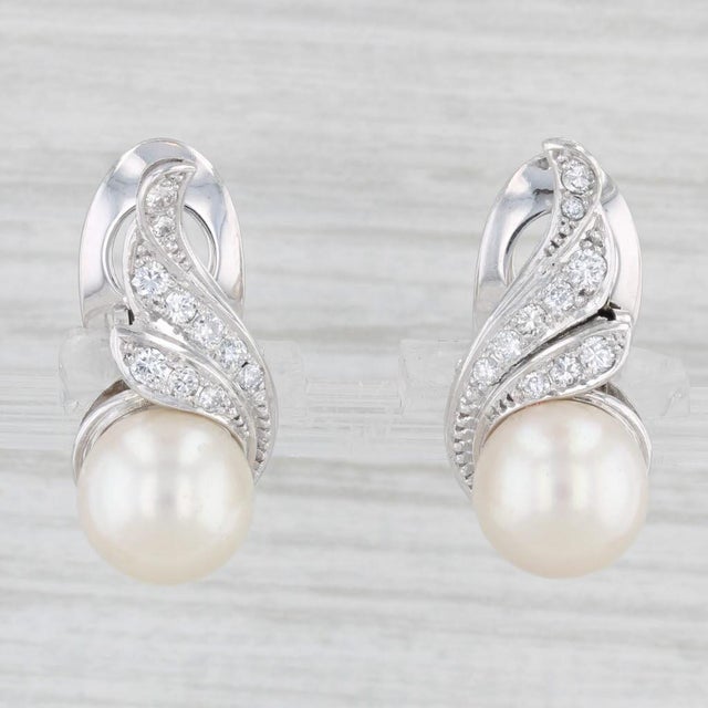 Gemstone Information: - Cultured Pearls - Size - 9 mm Cut - Round Bead Shape Color - White - Natural Diamonds - Total...