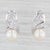 Gemstone Information: - Cultured Pearls - Size - 9 mm Cut - Round Bead Shape Color - White - Natural Diamonds - Total...