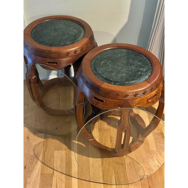 This pair of hardwood drum tables - or stools - are possibly made from a type of rosewood. They feature an inset dark...