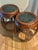 This pair of hardwood drum tables - or stools - are possibly made from a type of rosewood. They feature an inset dark...