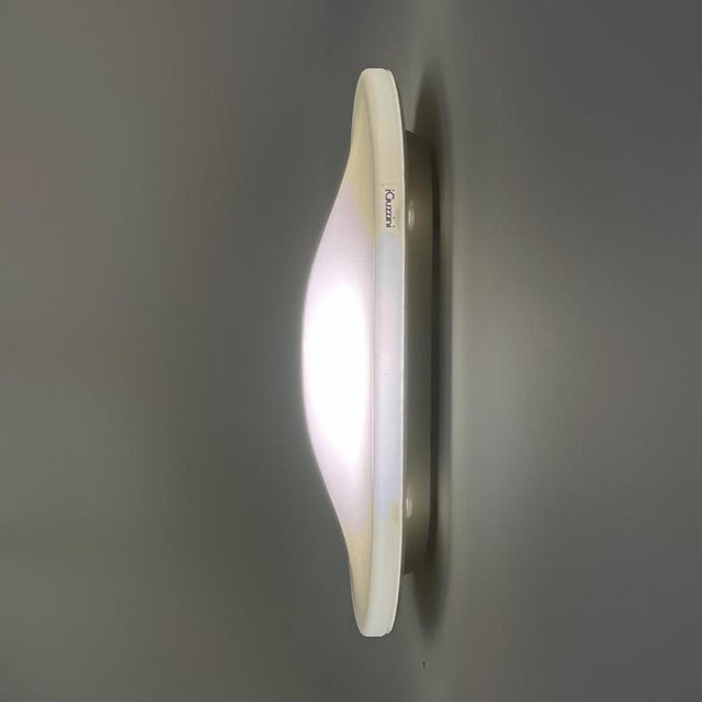 Guzzini wall or ceiling lamp model 5346 designed by the design team of iguzzini in 1979. Very beautiful timeless lamp...