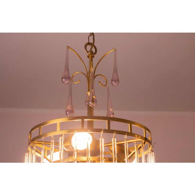 Gorgeous Murano chandelier in the style of Venini La Cascata. The frame is crown-shaped. The chandelier is composed of...