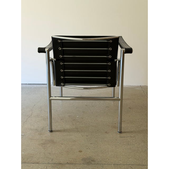 LC1 “Fauteuil à dossier basculant” armchair designed by Le Corbusier, Pierre Jeanneret, and Charlotte Perriand in 1928 and...