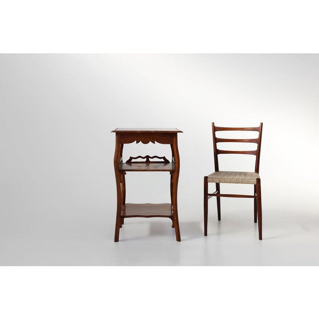 A graceful French side table from the 1920s, blending the geometric clarity of Art Deco with the flowing, organic lines of...