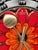 Vintage Junghans Wall Clock 37 cm, Height: 2 cm Material: Ceramic and iron frame Vibrant colors: Red, Orange, Metallic...