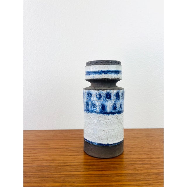 Vintage 1960s Blue & White Ceramic Vase made of a pottery material blue & milky white color round column shape measures...