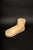 This large carved wooden foot showcases a stylized representation of the human form, with a focus on simplicity and an...