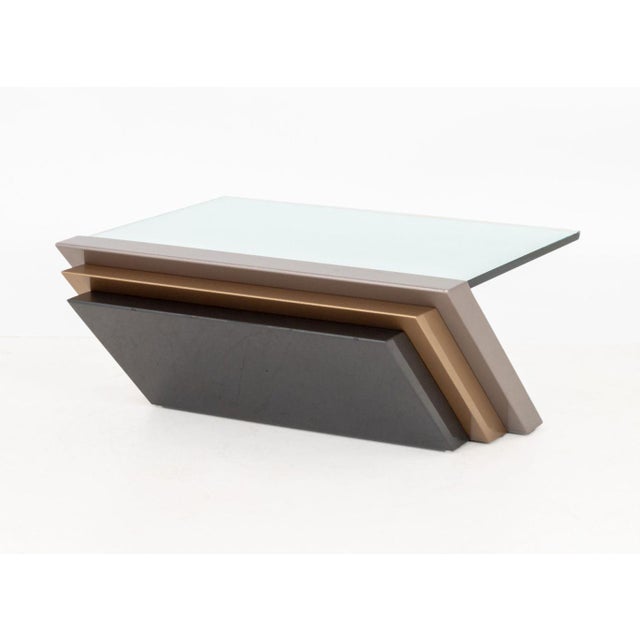 Modern Cantilevered Glass Top Coffee Table, with metallic patinated metal base and rectangular glass top. 16" H x 35.5" W...
