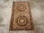 An antique East Turkestan Khotan throw rug handmade during the Early 20th century. Measures: 1' 11" x 3' 6"