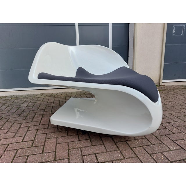 This Panta Rhei armchair, designed by Florian Baptist Gypser, is a remarkable sculptural piece that perfectly illustrates...