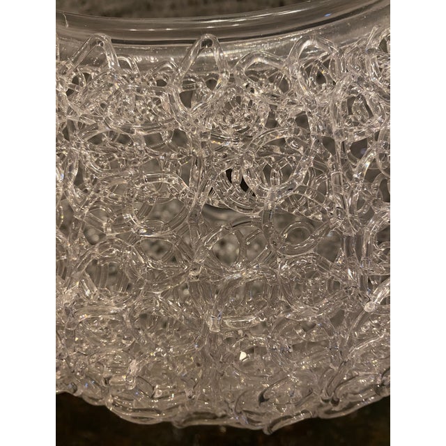 A vintage clear acrylic spaghetti-style light shade, dating to the 1970s. Crafted in a looped lucite design that...
