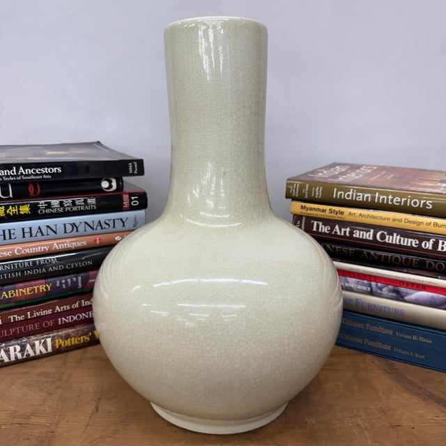 "About This Piece About This Piece This vase brings a timeless elegance with its soft ivory glaze, enriched by a delicate...