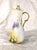 This is an unmarked but signed tall slender chocolate pot. The pot is white with a floral design on the left, but almost...