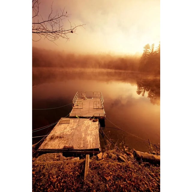 A floating dock that has been tethered to shore for the winter, shows the wear of summers past. Unframed Tethers by...
