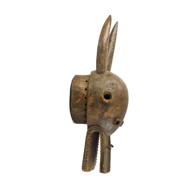 The Senufo Firespitter Helmet Mask is a captivating symbol deeply rooted in the traditions of the Senufo people across...