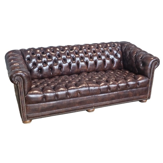 Store Item: Classic Chesterfield Brown Top Grain Leather Tufted Leather Sofa Nail Head Trim Description: Chesterfield...